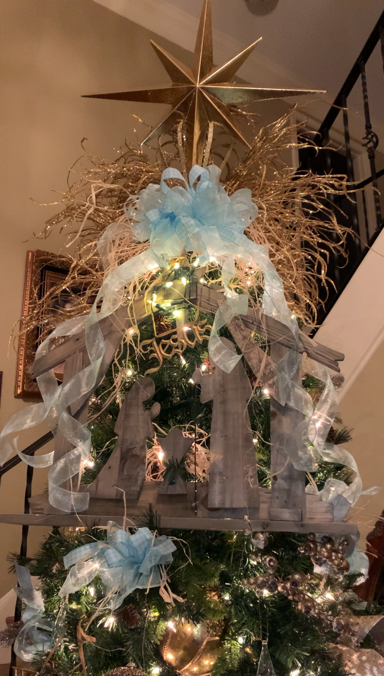 Flocked Christmas tree with red and green ribbon