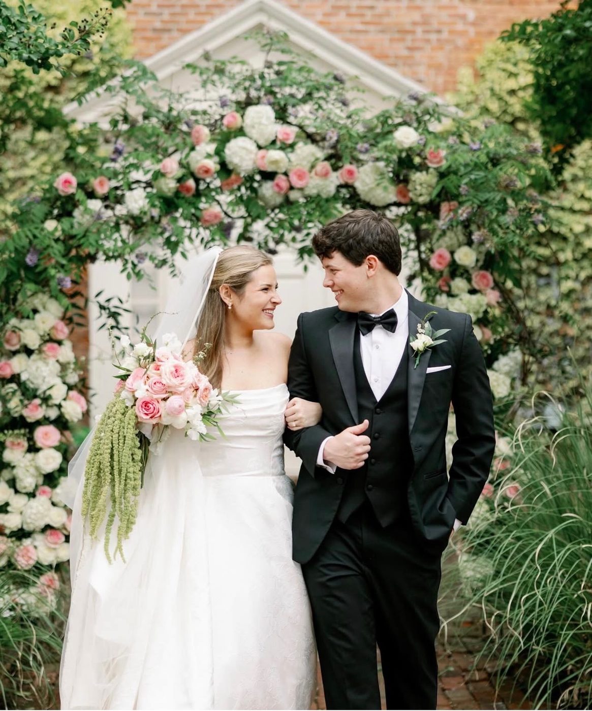 Garden wedding arch with pink and white roses
